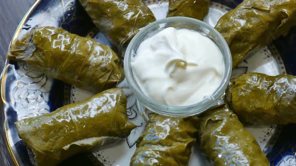 Delicious Dolma with the Cream Sauce on a Asian Plate alt