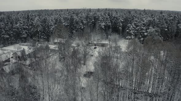 Winter Landscape of a Russian Village in the Forest