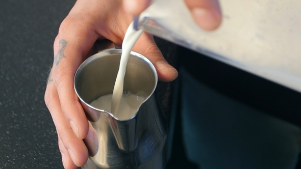 Barista Pours Milk Making Cappuccino or Latte