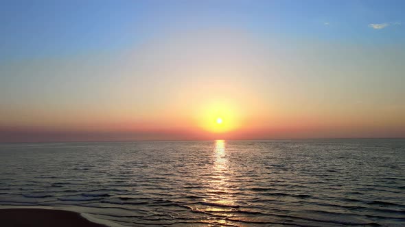 Calm Sunrise over the sea alt