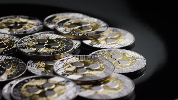 Rotating shot of Bitcoins (digital cryptocurrency) - BITCOIN RIPPLE  alt