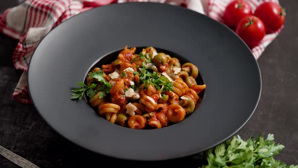 Tasty Appetizing Classic Italian Pasta with Tomato Sauce Cheese Parmesan and Basil on Plate
