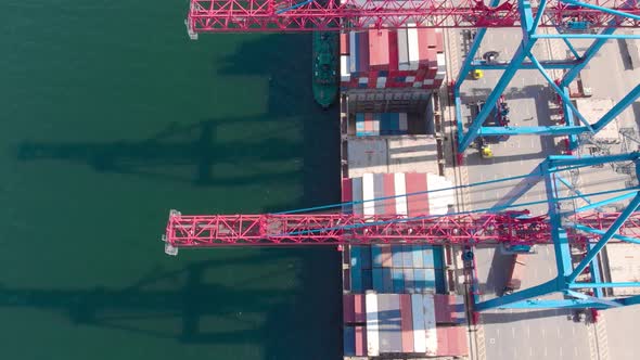 Drone Flying Over a Container Ship During Cargo Operations Over the Customs Area alt