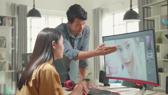 Asian Male And Female Professional Editors Arguing While Working In Photo Editing alt