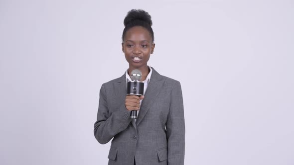 Young Beautiful African Businesswoman As Newscaster alt