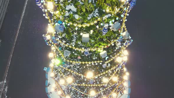 Gorgeous Lights on the New Year Tree in the Center of the Square Aerial View alt
