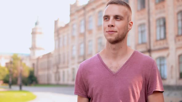 Close Up Young Fair Man Walking in Summer City alt