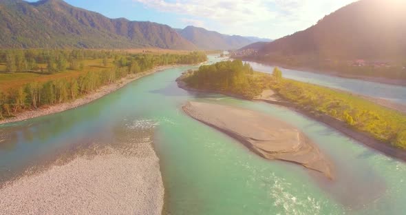 Low Altitude Flight Over Fresh Fast Mountain River with Rocks at Sunny Summer Morning alt