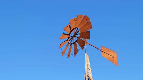 The Propeller That Determines the Direction of the Wind It Rotates Against the Blue Sky alt