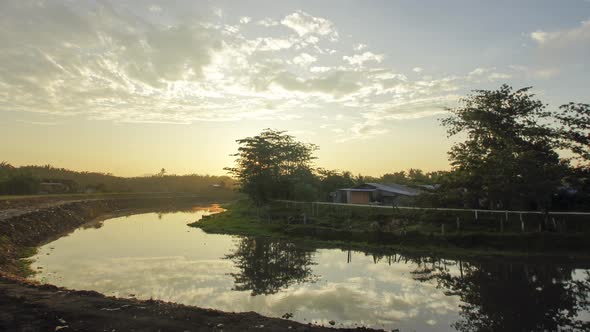 Timelapse sunrise at river near Malay kampung alt
