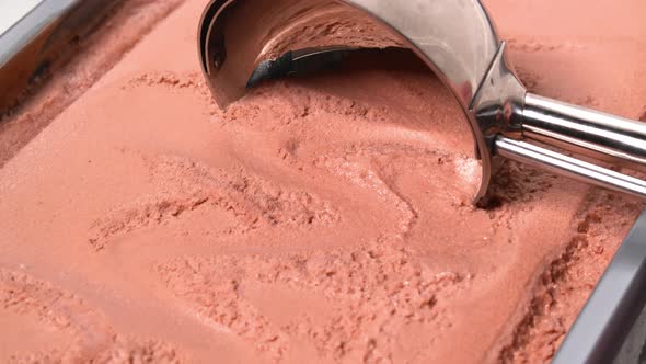 4K - Scooping up chocolate ice cream. Close-up alt
