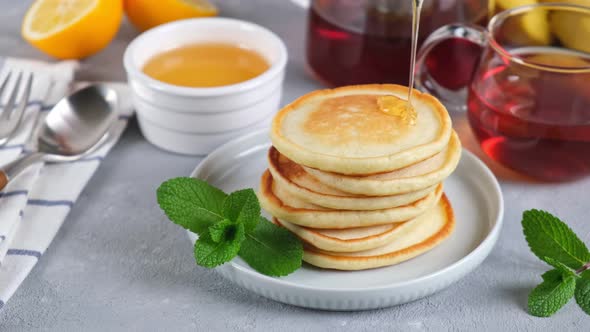 Pancakes with honey. Tasty sweet breakfast food