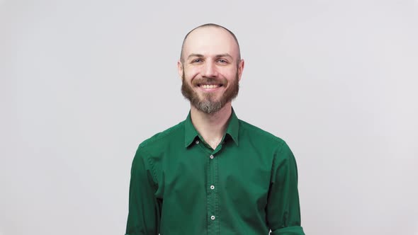 Portrait of a smiling handsome middle aged man over white background