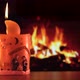Christmas Candle in front of Fireplace at Cozy Winter Home - VideoHive Item for Sale