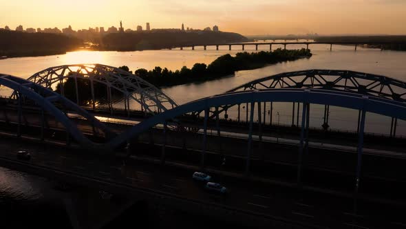 Aerial Top View of the Bridge and River During Sunset alt