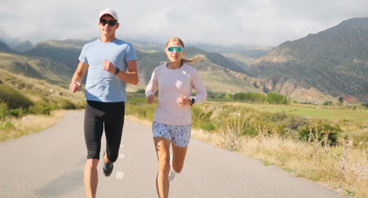 Athletic man, woman and couple running in the mountains