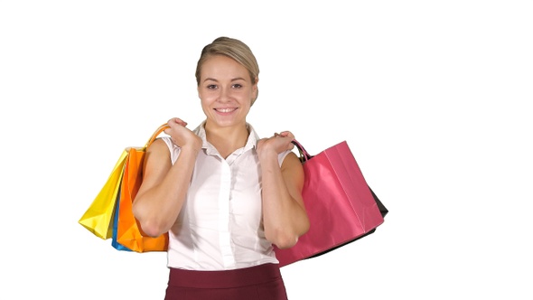 Young Woman Walking and Hold Shopping Bags While Doing alt