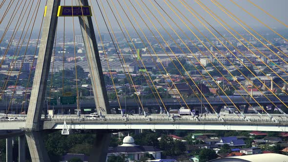 close up road and traffic on Bhumibol suspension bridge cross over Chao Phraya River in Bangkok alt