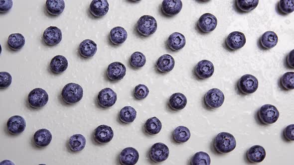 The Handful of Ripe Fresh Juicy Blueberry on the White Surface