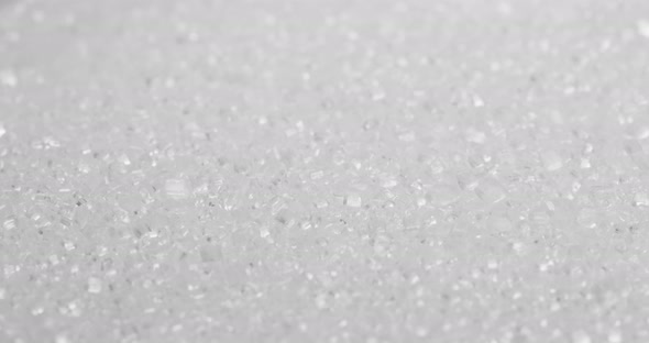 Stack of white sugar in rotation alt