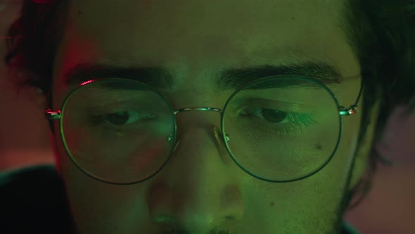 Closeup of Hacker Face Stealing Information Preparing to Break Password