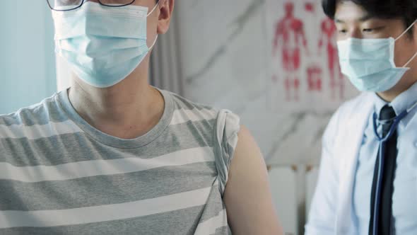 Asian doctor encouragement and supportive to cansor patient after consult