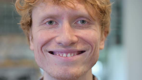 Close Up of Face Young Redhead Man Smiling at the Camera alt