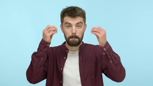 Slow Motion of Shocked Bearded Man Hear Mindblowing Information Showing Head Explosion Boom Gesture