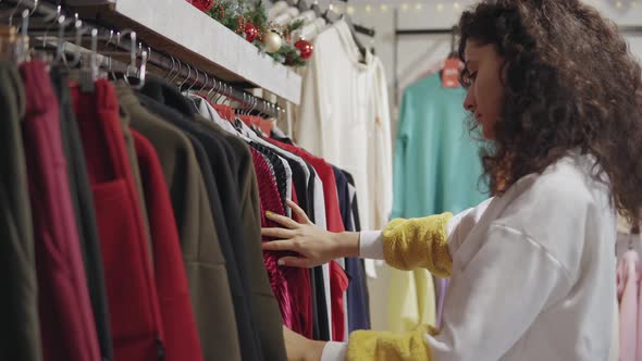Young Girl Shopping in a Clothing Store alt