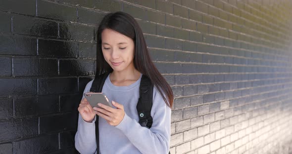 Woman use of smart phone at outdoor alt