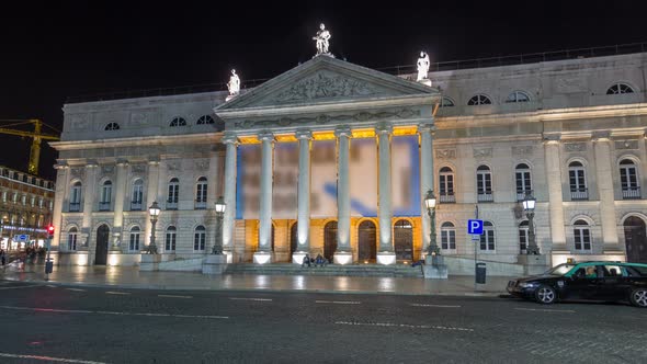 Traffic at Night at the Rossio Square in Front of the National Theater Dona Maria II Timelapse alt