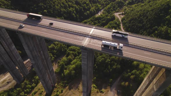 Top View of Heavy Truck Traffic on the Highway Viaduct in the Evening alt