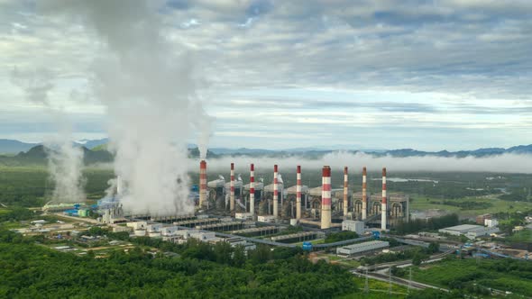 Aerial view over coal-fired power plant at sun dawn.