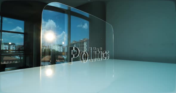 Glass Politics Letters and Office in Background alt