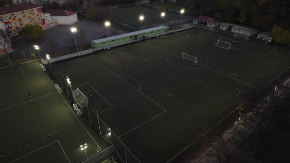 Night Soccer Training on Football Field Aerial View alt