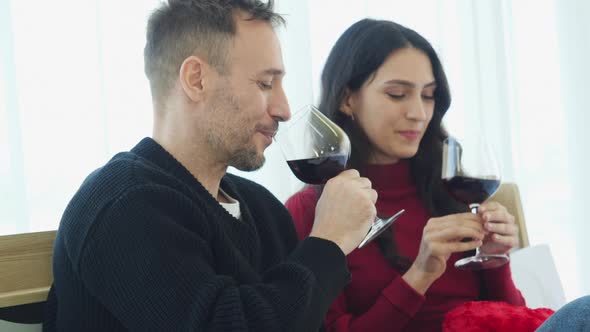 Young casual drinking wine alt