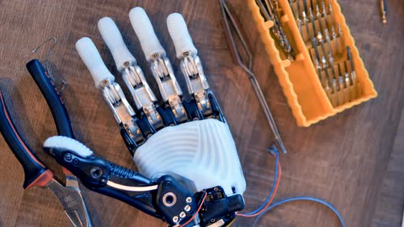 Cyborg Arm at Engineers Desk alt