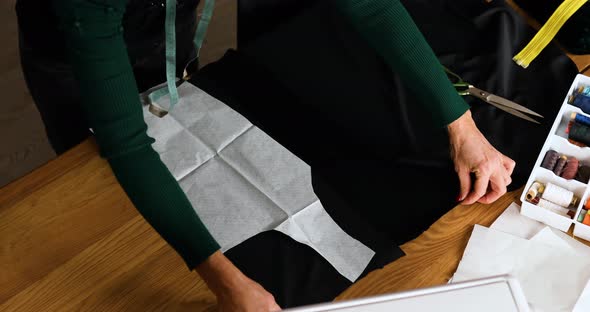 Step by step, Woman dressmaker making sewing patterns alt