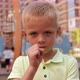 A Little Boy on a Modern Playground Playing the Game Rock Paper Scissors - VideoHive Item for Sale