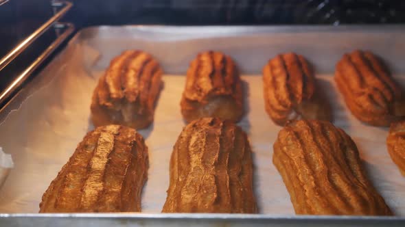 French Custard Eclairs are Baked in the Oven Until Tender