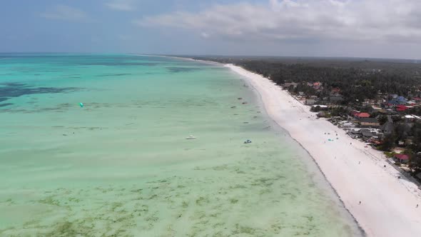 Ocean Coastline with Paradise Beach Hotels and Palm Trees Zanzibar Aerial View alt