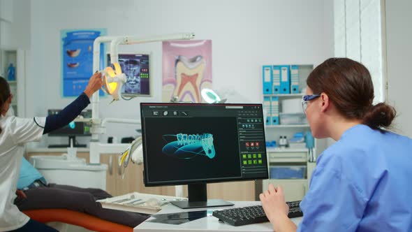 Nurse Working at Digital Dental Fingerprint of Patient alt