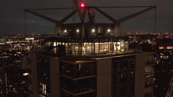 Top Lookout Terrace of Castilla Apartment Building and Night Cityscape alt