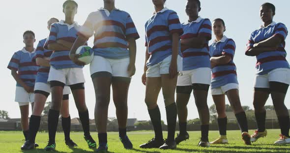 Portrait of young adult female rugby team alt
