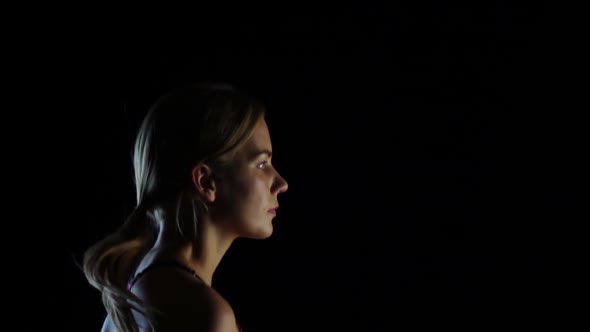 Busy Person Running the Girls Side View on Black Background. Slow Motion. Close Up alt