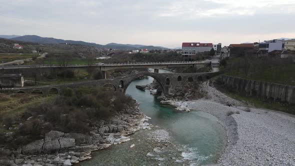 Shkodër,Albania. Beautiful view of Mesi Bridge with blue water running underneath.