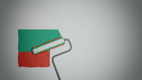 Roller paints the wall in colors of Bulgarian flag. alt