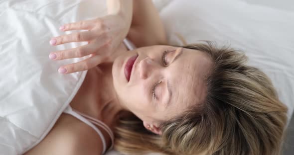 Young Woman Looking Under Covers and Screaming  Movie Slow Motion alt