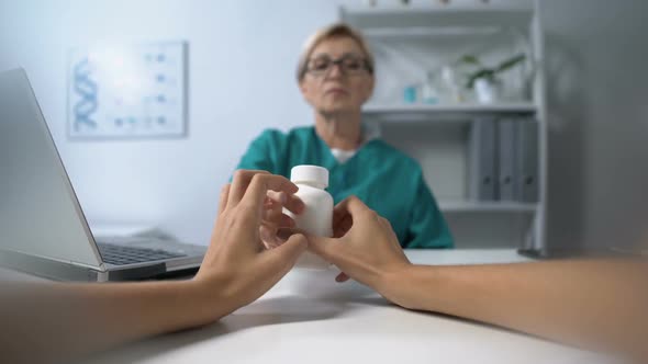 Female Doctor Giving Jar With Medicine to Woman, Pov of Patient, Prescription