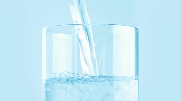 Clear Water Pours Into Glass Closeup alt